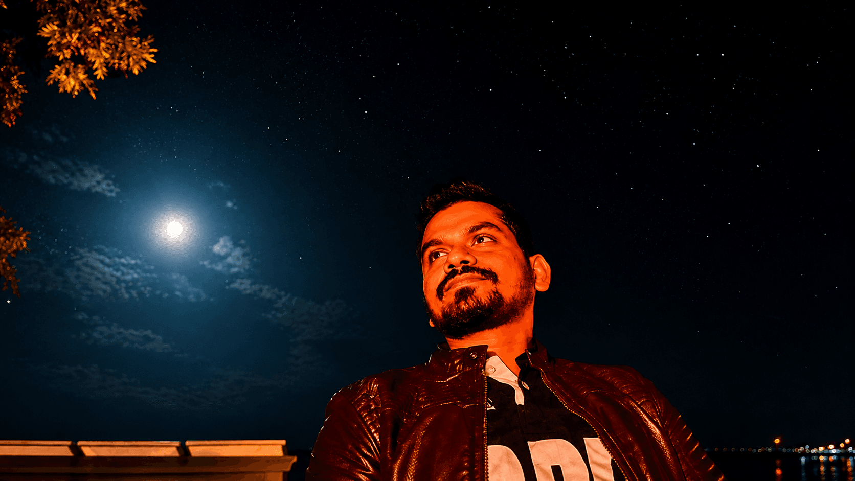 Manas Majhi under a moonlit starry sky on a night safari