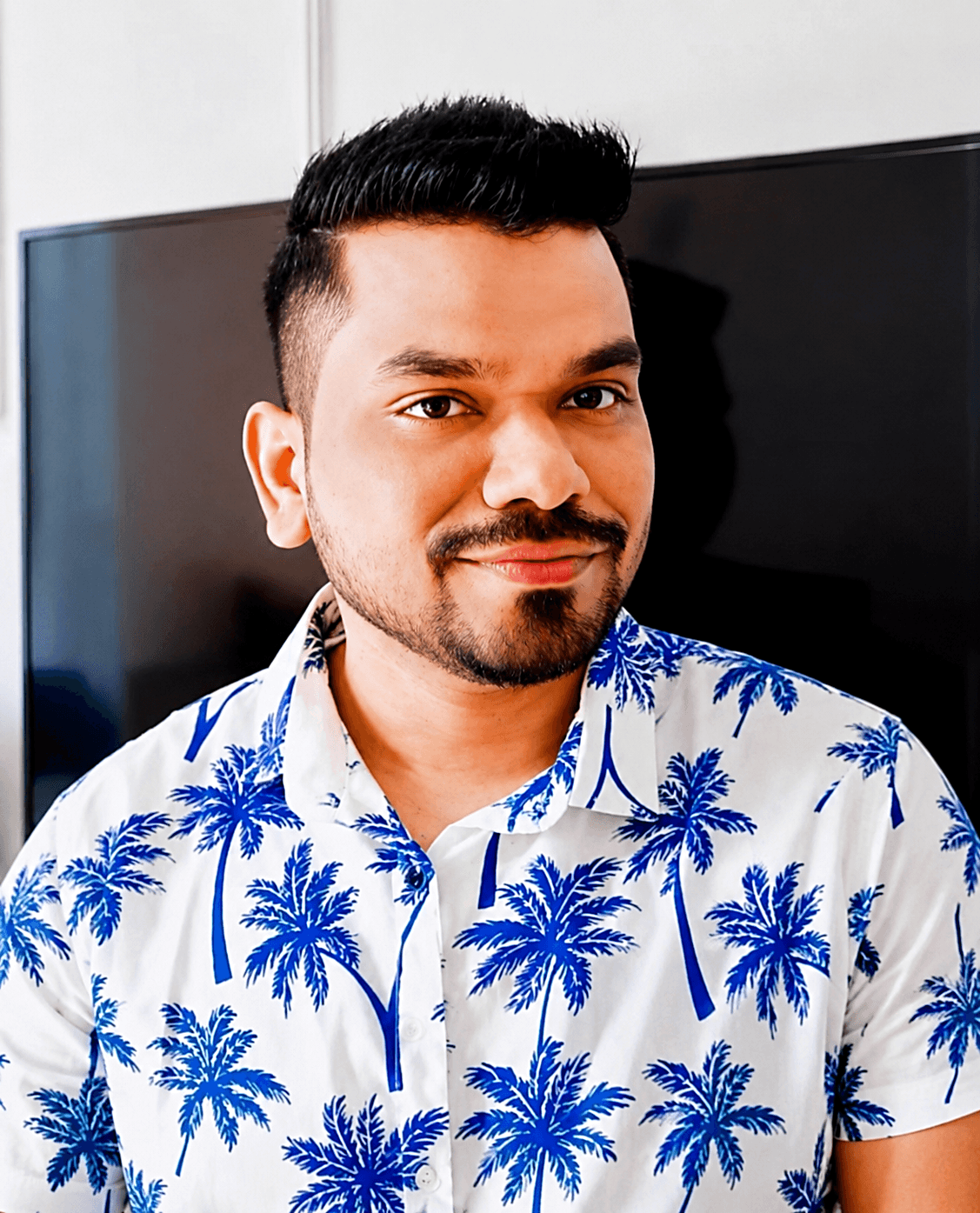 Manas Majhi in a palm print shirt, relaxed portrait